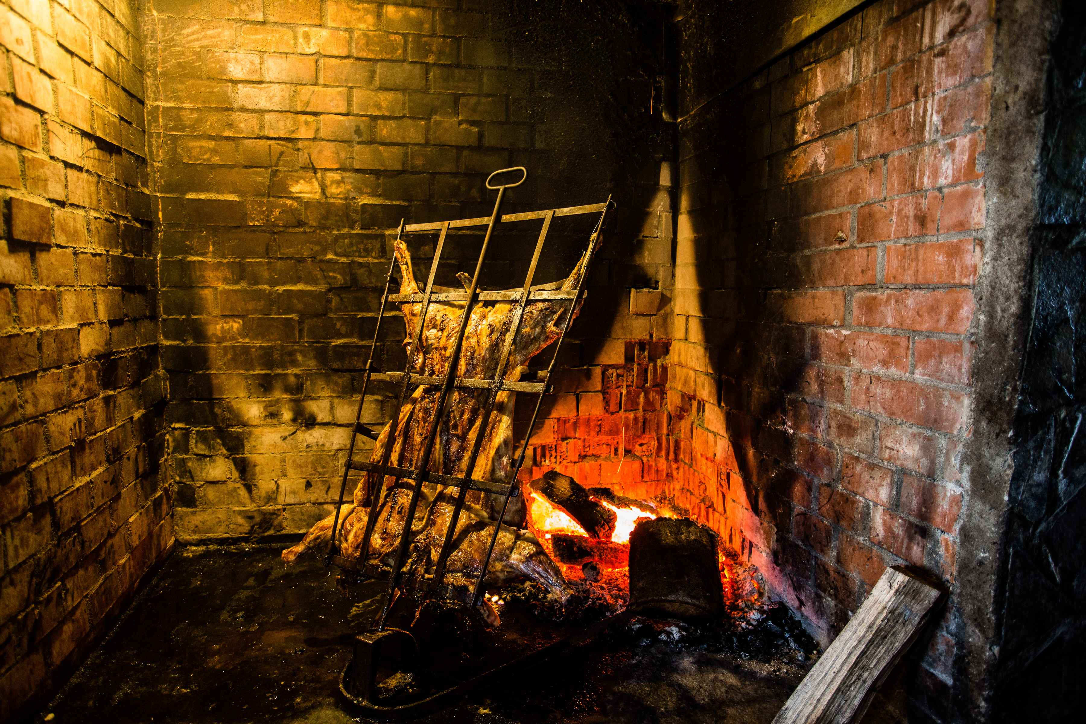 A whole lamb cooks at a first-night asado at Yelcho en la Patagonia (photo: Chad Shmukler). lamb asado - patagonia - chile
