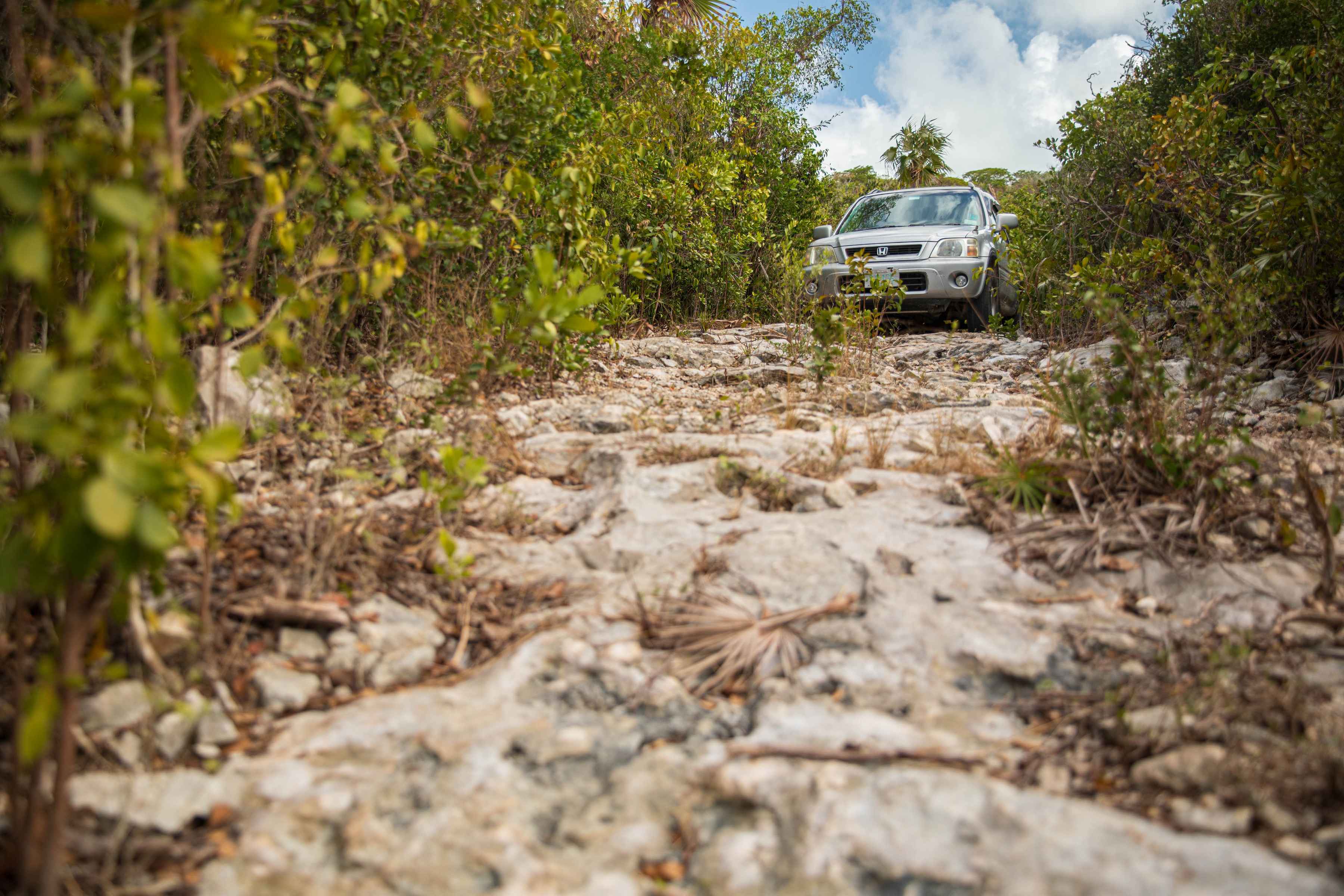 The "little Honda that could" sits at the terminus of the "road" to the Clarence Town Harbor flat (photo: Chad Shmukler). rental car bahamas
