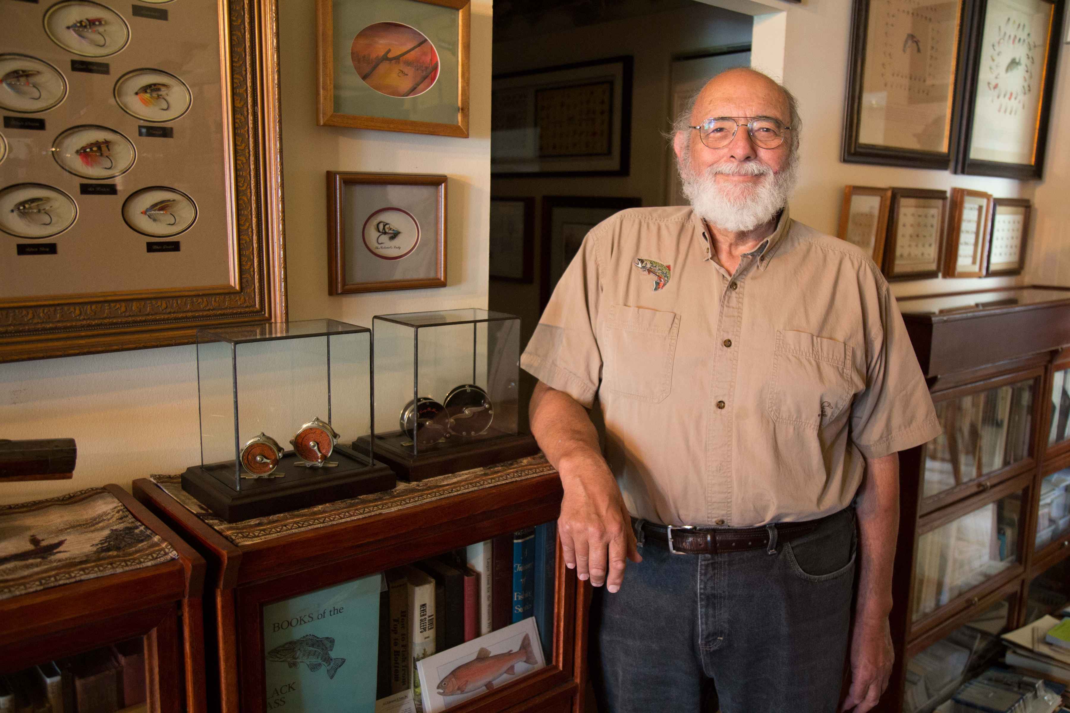 Fly fishing antique collector Jerry Girard of Bensalem, PA poses with part of his collection (photo: Steve Woit). jerry girard collector