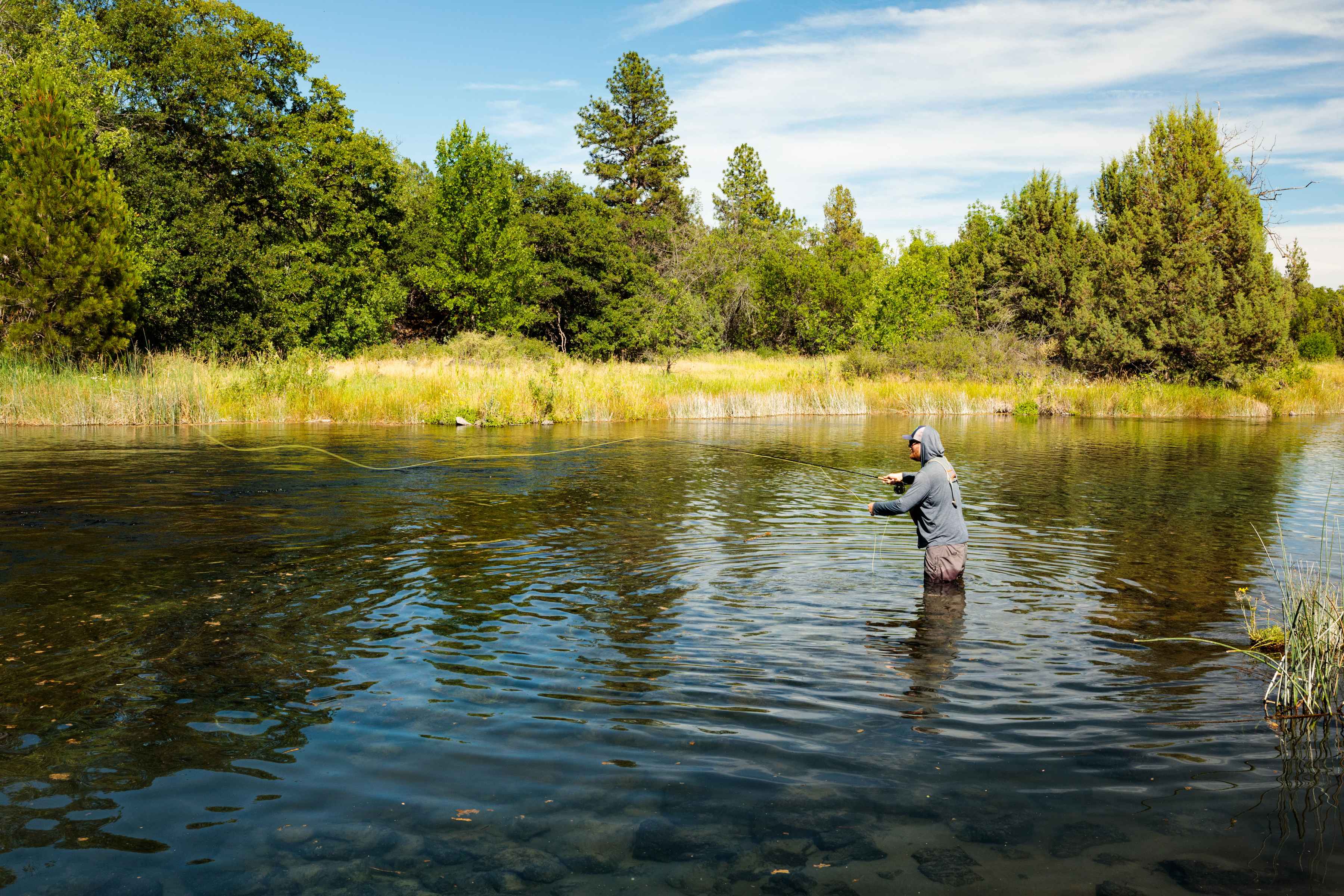 Dan Johnson fishing the Ahjumawi Lava Springs (photo: Kimberley Hasselbrink). Dan Johnson fishing the Ahjumawi Lava Springs