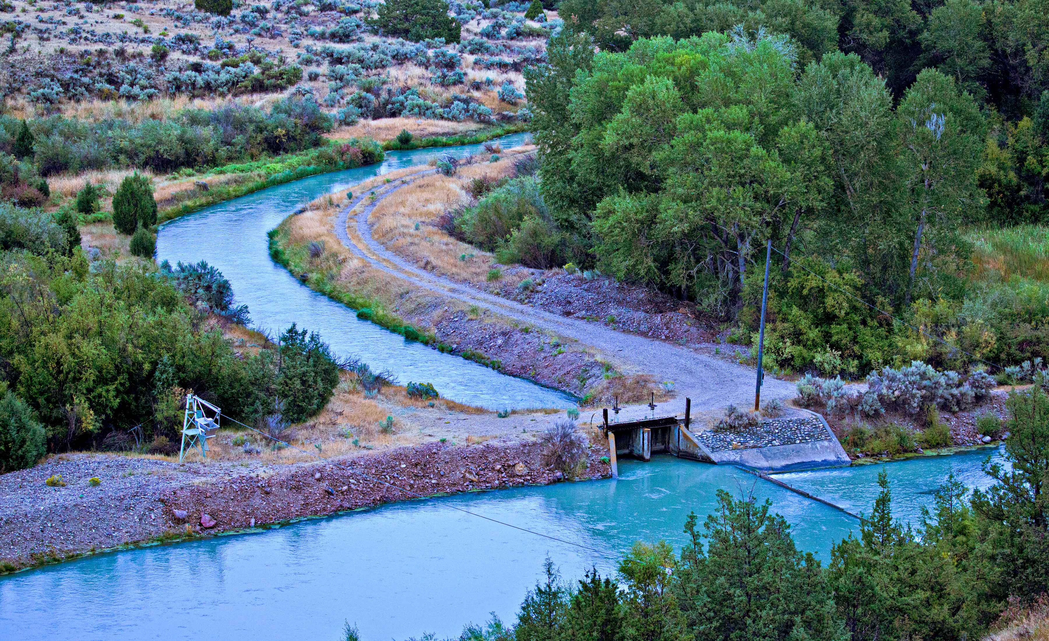A single diversion - this one on the on the Ruby River - can divert a large portion of a river's flow. In mid-June, streamflows in the Ruby River dropped to a mere 20 cfs, causing water temperatures to spike to over 80 degrees Fahrenheit and leading to emergency fishing closures (photo: Pat Clayton / Fish Eye Guy Photography). ruby river diversion montana