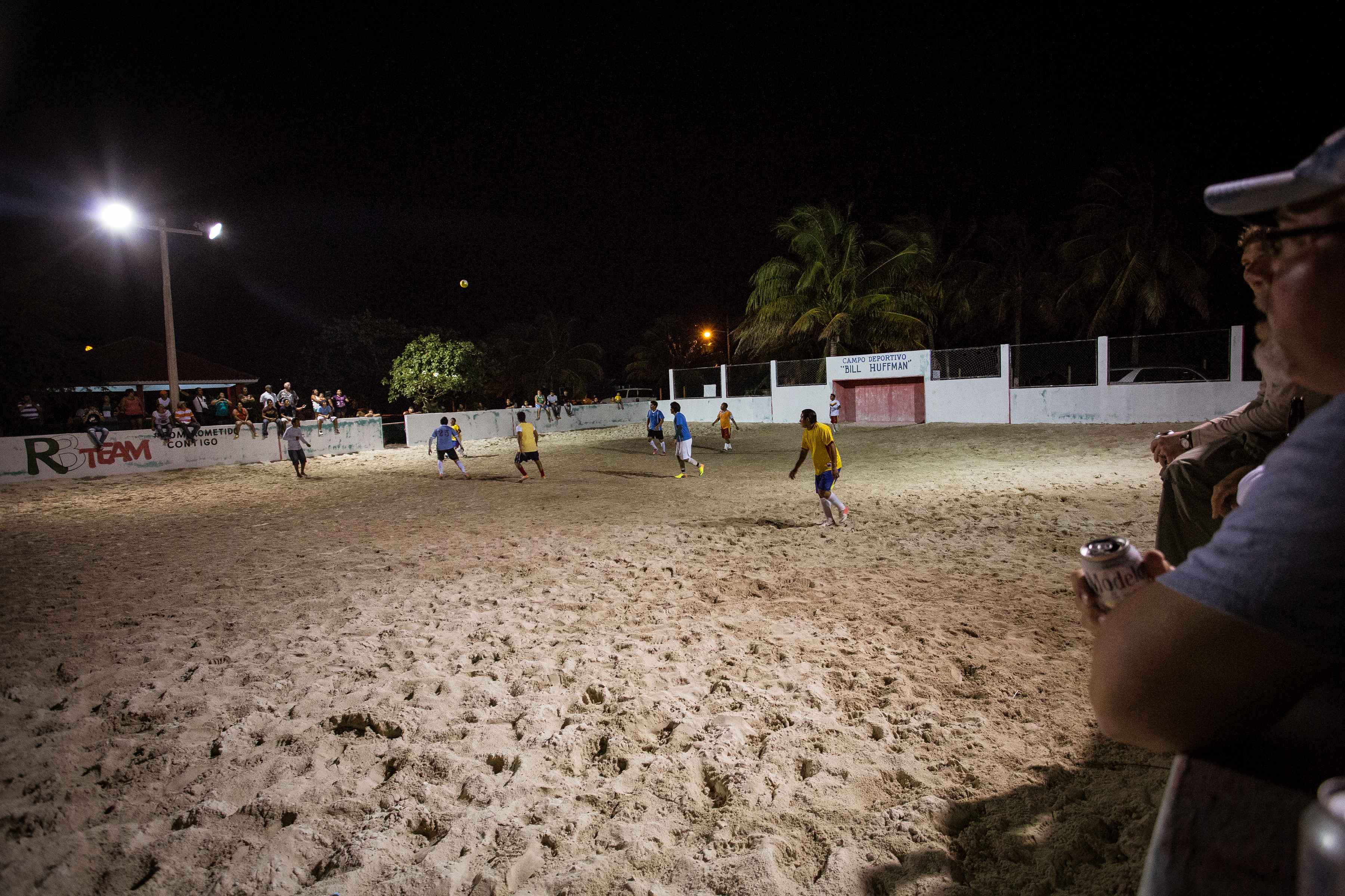 A handful of barefoot steps down the beach and up a sandy side street leads to the local football stadium where virtually every inhabitant of Punta Allen has gathered to take in the local championship. Soccer Game - Punta Allen, Mexico
