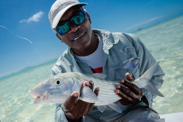 Anegada bonefish guide Garfield Faulkner shows off a healthy British Virgin Islands bonefish. (photo: Chad Shmukler)